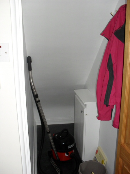 Photo - Kitchen Before and After (4 of 6) - Refurbed understairs area with new electricity fuse box and meter fitted within a purpose built cupboard. - Property Refurbishment - Home - © J C Joinery