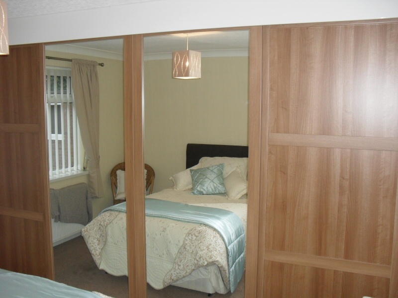 Photo - Fitted Wardrobe (1 of 1) - Featuring mirrored sliding doors in walnut veneer for Thornton household. - Other Joinery and Building Work - Home - © J C Joinery