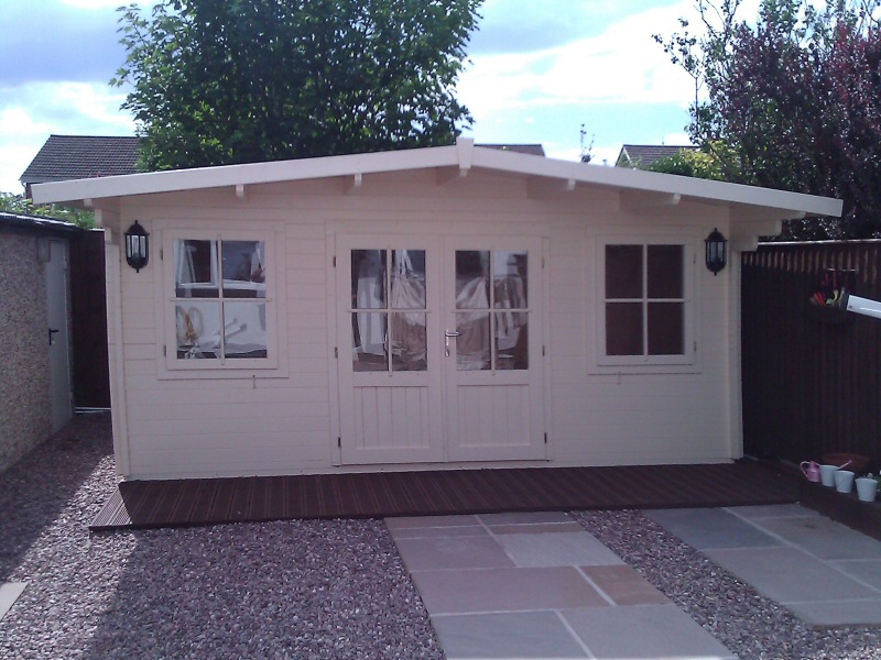 Photo - Outside Office (7 of 7) - The completed log cabin, painted and fitted with electrics including sockets, telephone line, cat5 ethernet cables and connected to the home alarm system. - Log Cabins - Home - © J C Joinery